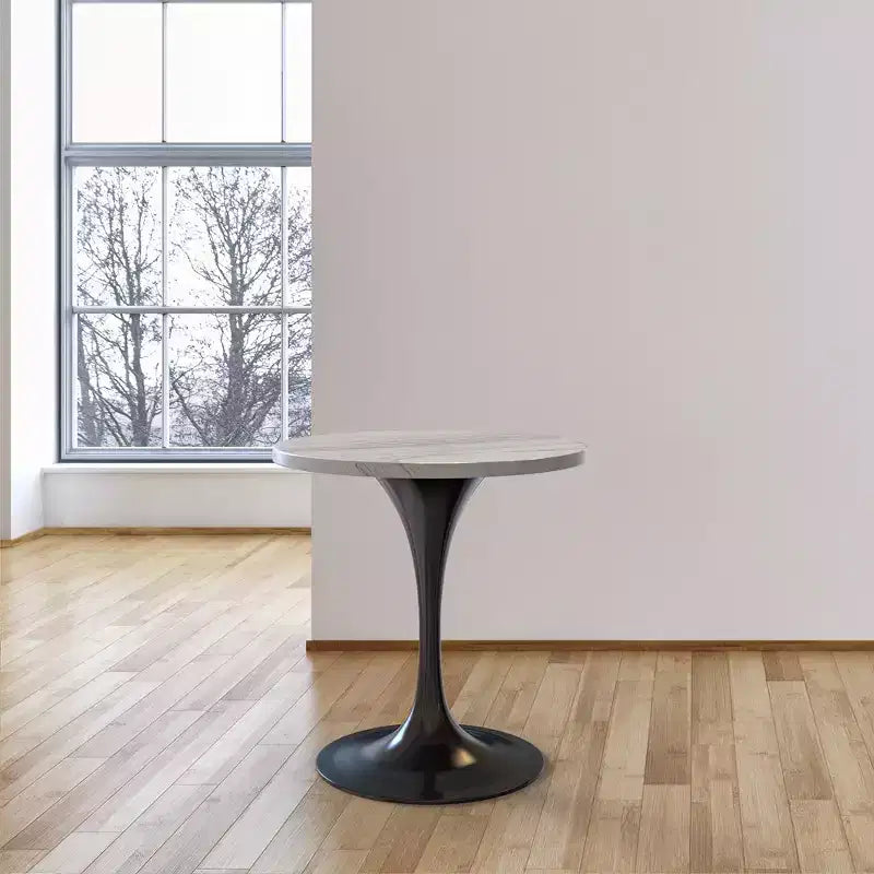 Tavolo da pranzo rotondo con piano in resina e base a piedistallo in acciaio